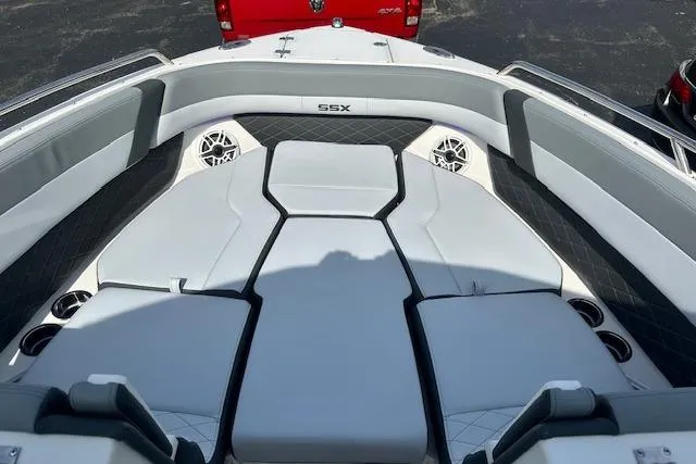 Slide: The Image of 2026 Chaparral 6 SSX boat interior with cushioned seating and cup holders. - 63