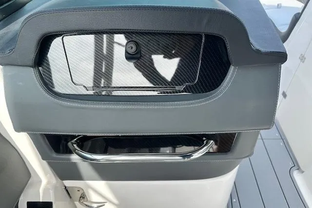 Slide: The Image of 2026 Chaparral 6 SSX boat interior with sleek carbon fiber and chrome accents. - 65
