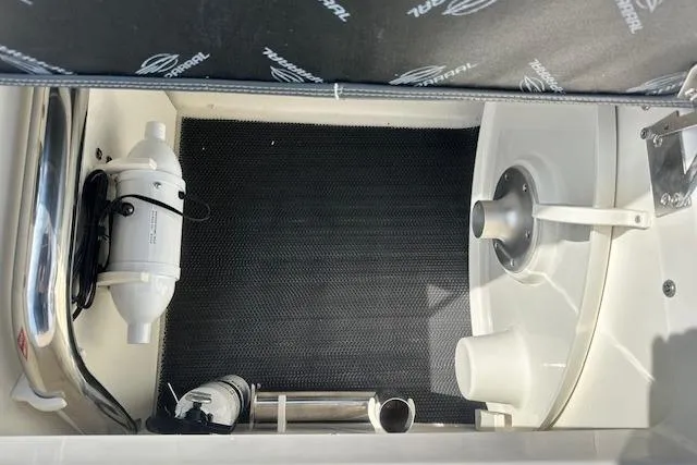 Slide: The Image of Interior view of 2026 Chaparral 6 SSX boat compartment with equipment. - 68