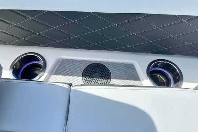 Slide: The Image of Interior of 2026 Chaparral 6 SSX boat with speakers and quilted upholstery. - 69