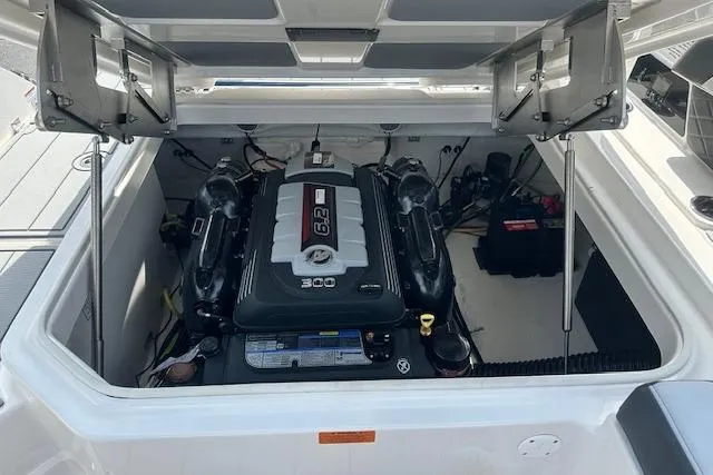 Slide: The Image of 2026 Chaparral 6 SSX boat engine compartment with 6.2L engine, open hatch view. - 70