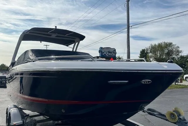 Slide: The Image of 2026 Chaparral 6 SSX boat on trailer, sleek design, under clear sky. - 9