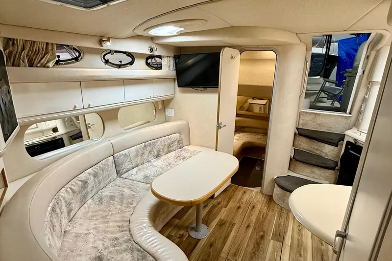 Slide: The Image of Interior of 1995 Sea Ray Sundancer 370 yacht with cozy seating and wooden flooring. - 16