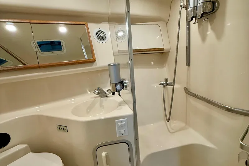 Slide: The Image of Bathroom interior of 1995 Sea Ray Sundancer 370 yacht, featuring shower and sink. - 24