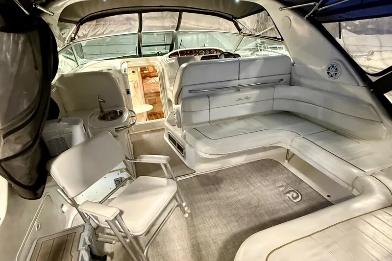 Slide: The Image of Interior of 1995 Sea Ray Sundancer 370 yacht, featuring spacious seating and elegant design. - 8