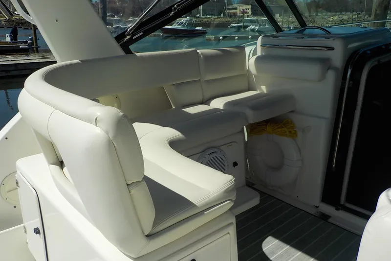 Slide: The Image of 2001 Tiara Yachts 3100 Open interior with white seating and marine equipment. - 17