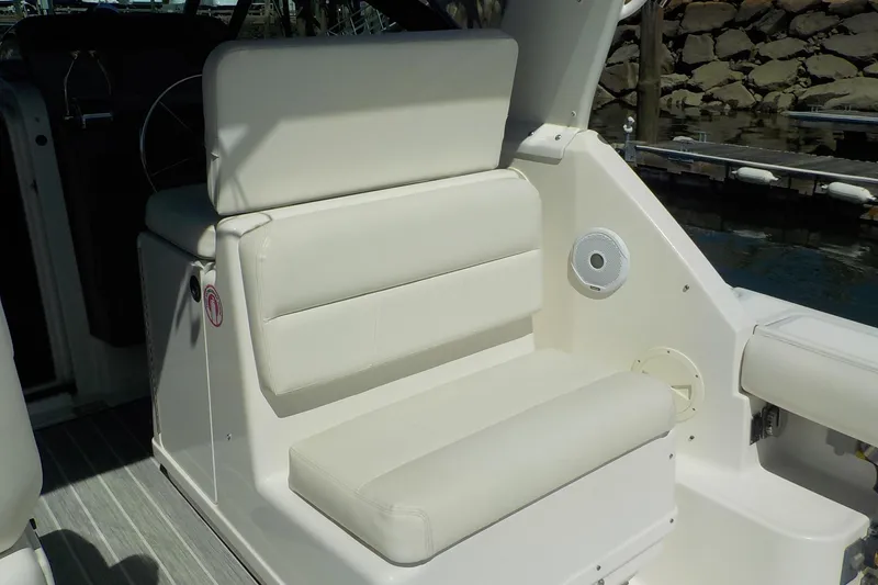 Slide: The Image of 2001 Tiara Yachts 3100 Open boat interior with white cushioned seating. - 18