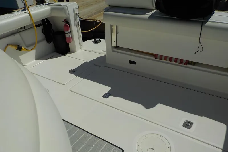 Slide: The Image of 2001 Tiara Yachts 3100 Open boat deck with storage compartments and fire extinguisher. - 21