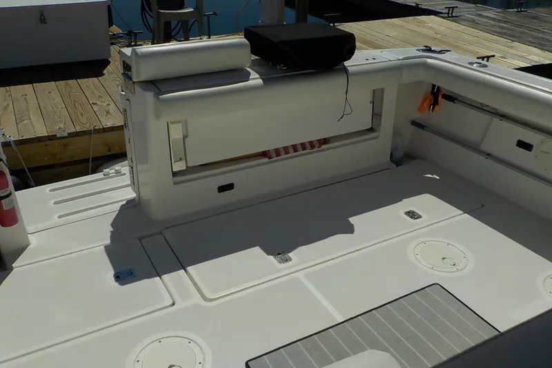 Slide: The Image of 2001 Tiara Yachts 3100 Open deck with storage compartments and seating. - 22