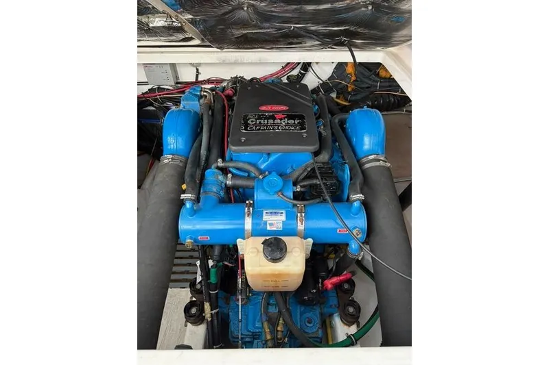 Slide: The Image of Engine compartment of a 2001 Tiara Yachts 3100 Open, featuring a Crusader engine. - 28