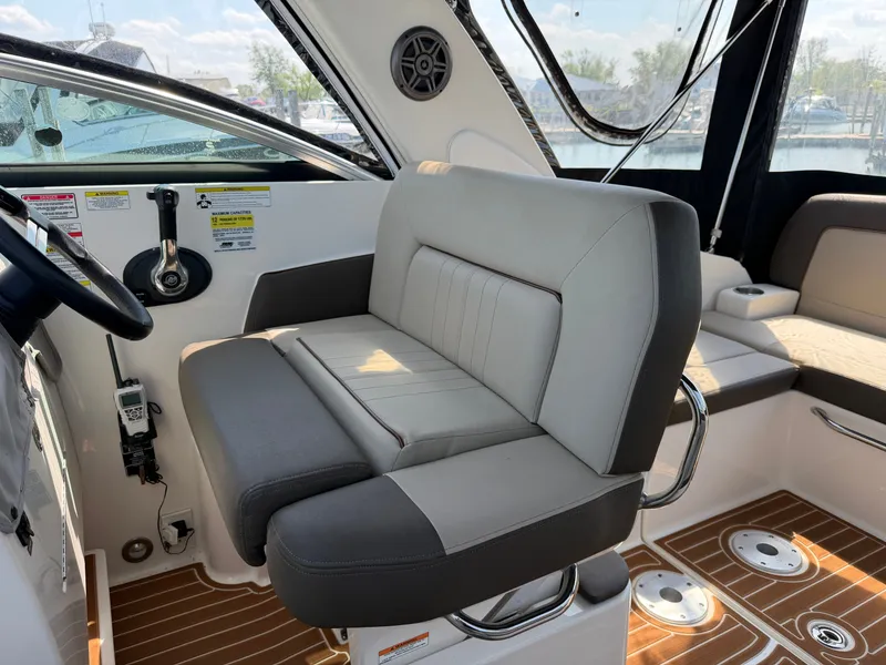 Slide: The Image of Interior of a 2014 Sea Ray Sundancer 260 with gray seating. - 11