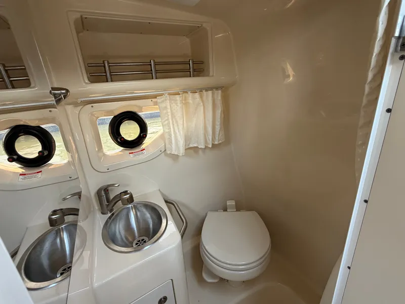 Slide: The Image of Interior of Sea Ray Sundancer 260 yacht, bathroom with sink and toilet. - 18