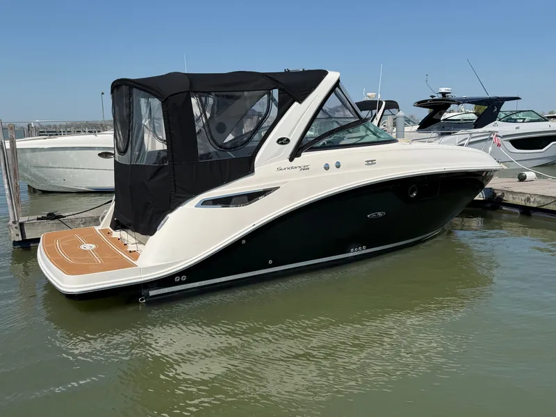 Slide: The Image of 2014 Sea Ray Sundancer 260 boat docked at marina. - 2