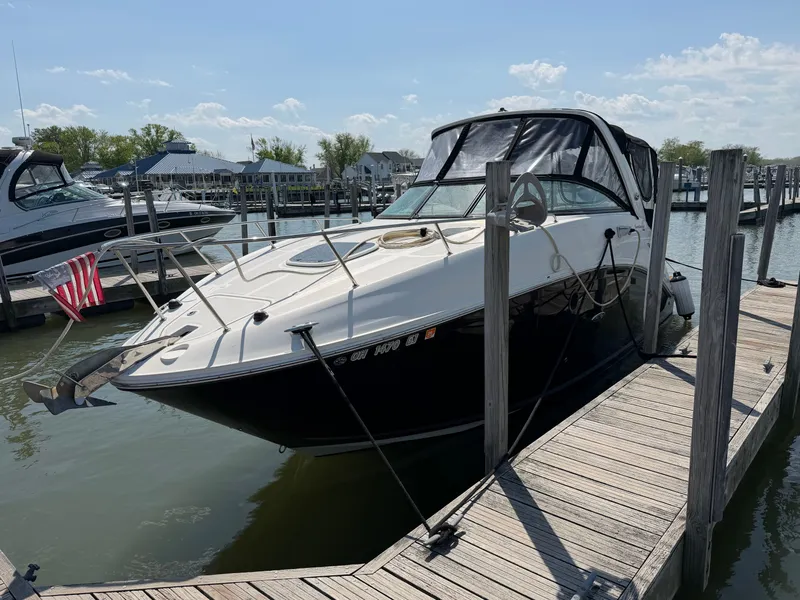 Slide: The Image of 2014 Sea Ray Sundancer 260 docked on a sunny day. - 4