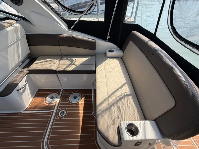 Slide: The Image of Interior of a 2014 Sea Ray Sundancer 260 with seating area. - 8