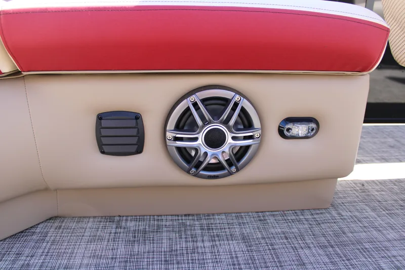 Slide: The Image of SunCatcher Select 20RC 2025 boat interior with speaker and red upholstery. - 13