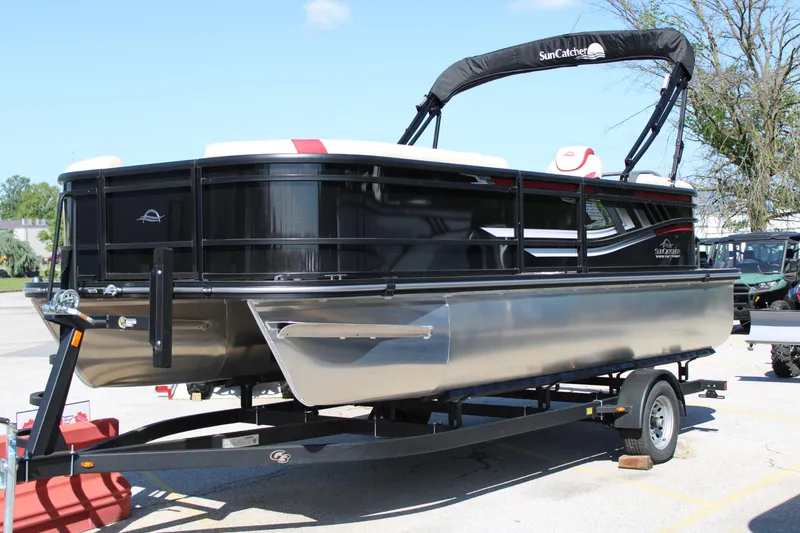 Slide: The Image of 2025 SunCatcher Select 20RC pontoon boat on trailer, sleek design, black and silver finish. - 3