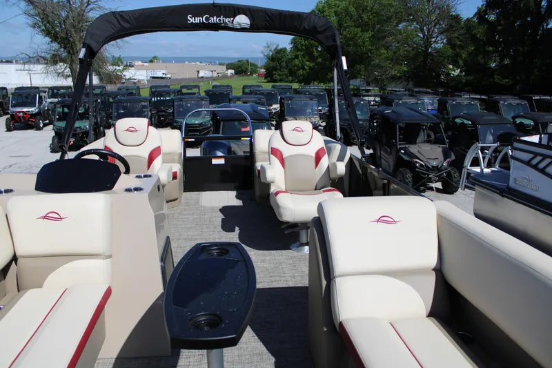 Slide: The Image of 2025 SunCatcher Select 20RC pontoon boat with luxurious seating and modern design. - 8