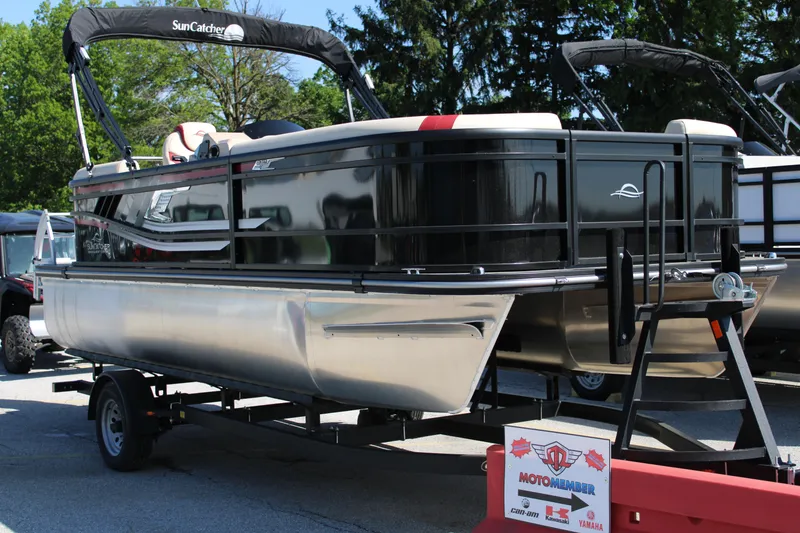 The Image of 2025 SunCatcher Select 20RC pontoon boat on trailer, displayed outdoors. - 1