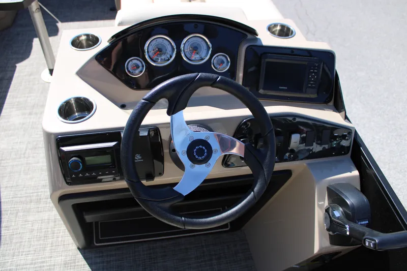 Slide: The Image of Steering console of 2025 SunCatcher Select 20RC boat with gauges and controls. - 11