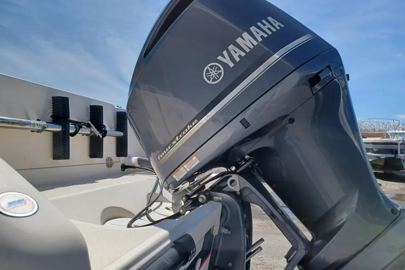 Slide: The Image of 2013 Pursuit OS 255 Offshore boat with Yamaha four-stroke outboard motor. - 6