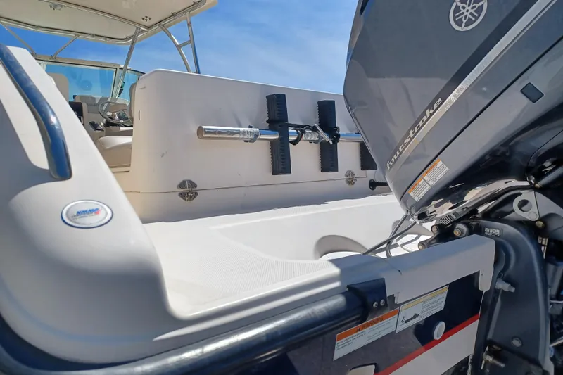 Slide: The Image of 2013 Pursuit OS 255 Offshore boat with Yamaha four-stroke engine, interior view. - 7