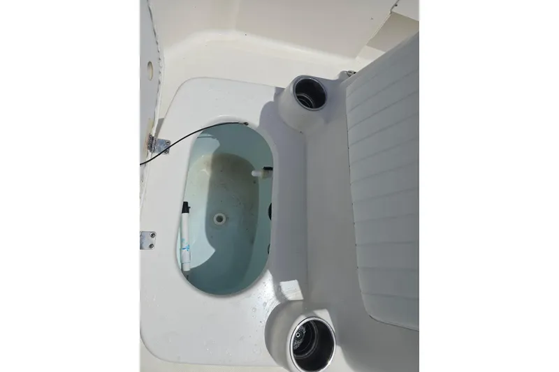 Slide: The Image of 2015 Sea Born FX22 Bay boat interior with open storage compartment. - 14
