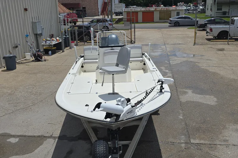 Slide: The Image of 2015 Sea Born FX22 Bay boat in a parking lot, featuring a trolling motor. - 3