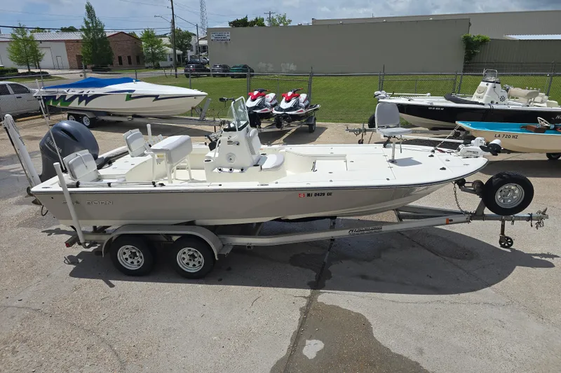 Slide: The Image of 2015 Sea Born FX22 Bay boat on trailer in outdoor lot. - 5