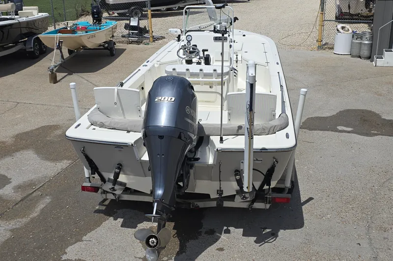 Slide: The Image of 2015 Sea Born FX22 Bay boat with Yamaha 200 engine, parked on concrete. - 7