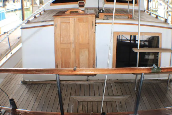 Slide: The Image of 1977 CHB Double Cabin boat deck with wooden doors and railing. - 17