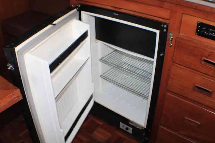 Slide: The Image of 1977 CHB Double Cabin refrigerator with open door and wire shelves. - 30