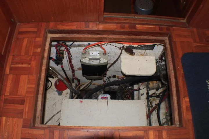 Slide: The Image of 1977 CHB Double Cabin engine compartment with visible wiring and components. - 34