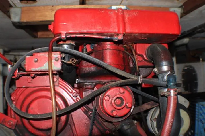 Slide: The Image of Red engine of a 1977 CHB Double Cabin boat, showcasing mechanical components. - 38