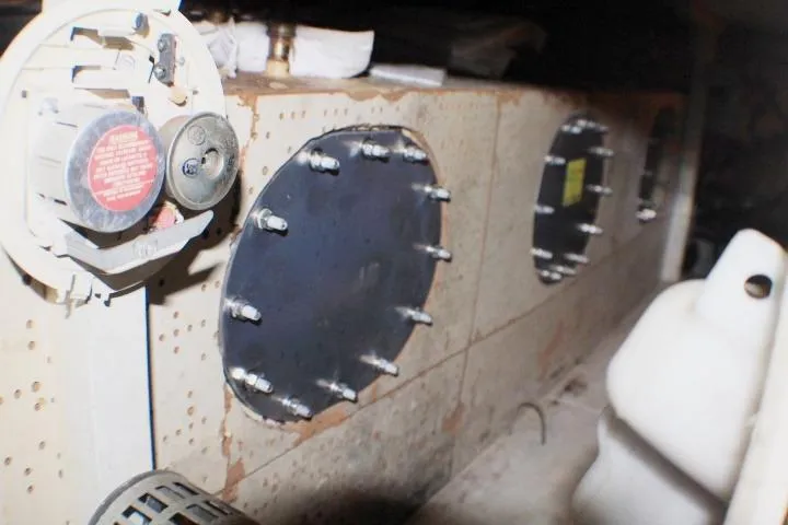 Slide: The Image of 1977 CHB Double Cabin engine room with mechanical components and circular access panels. - 39