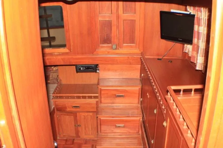 Slide: The Image of 1977 CHB Double Cabin interior with wooden cabinetry and small TV. - 43