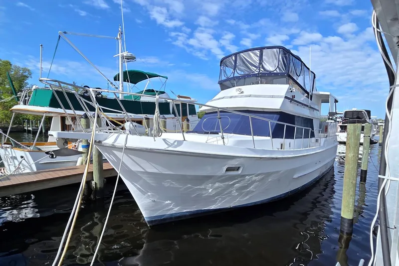 The Image of 1984 Present Yachts 42 Sundeck docked, featuring classic design and spacious upper deck. - 0
