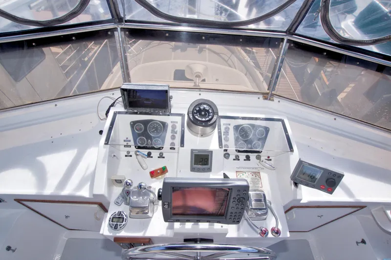 Slide: The Image of Cockpit of 1984 Present Yachts 42 Sundeck with navigation instruments and controls. - 20