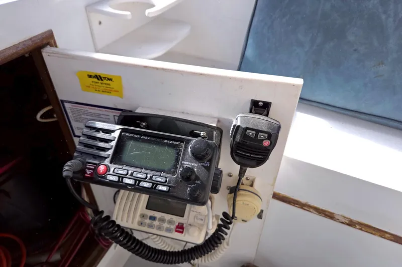 Slide: The Image of Radio equipment on a 1984 Present Yachts 42 Sundeck boat dashboard. - 22