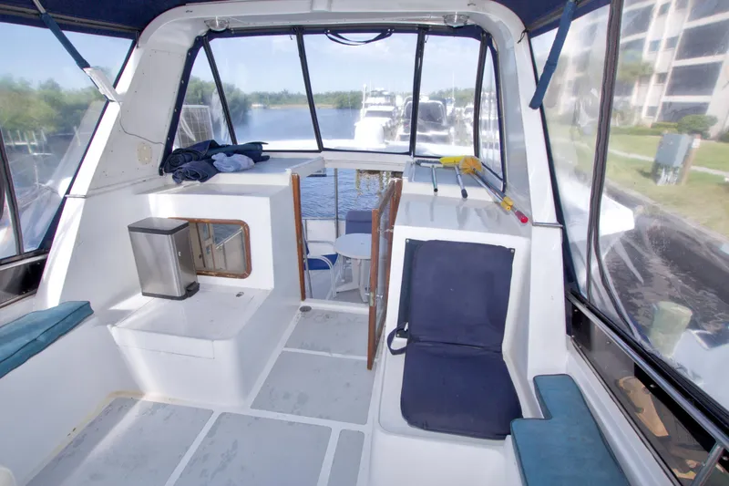 Slide: The Image of 1984 Present Yachts 42 Sundeck interior with seating and water view. - 24