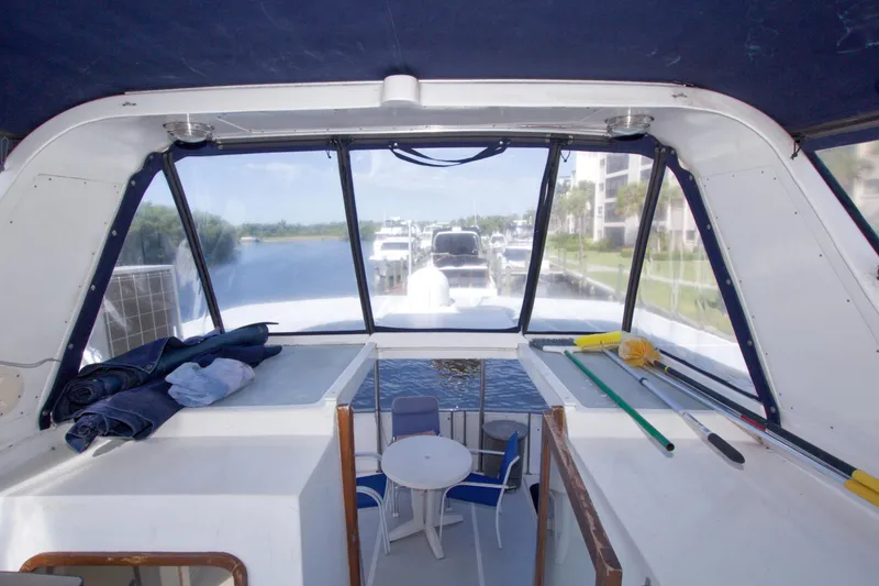 Slide: The Image of Interior view of 1984 Present Yachts 42 Sundeck with seating and cleaning tools. - 25