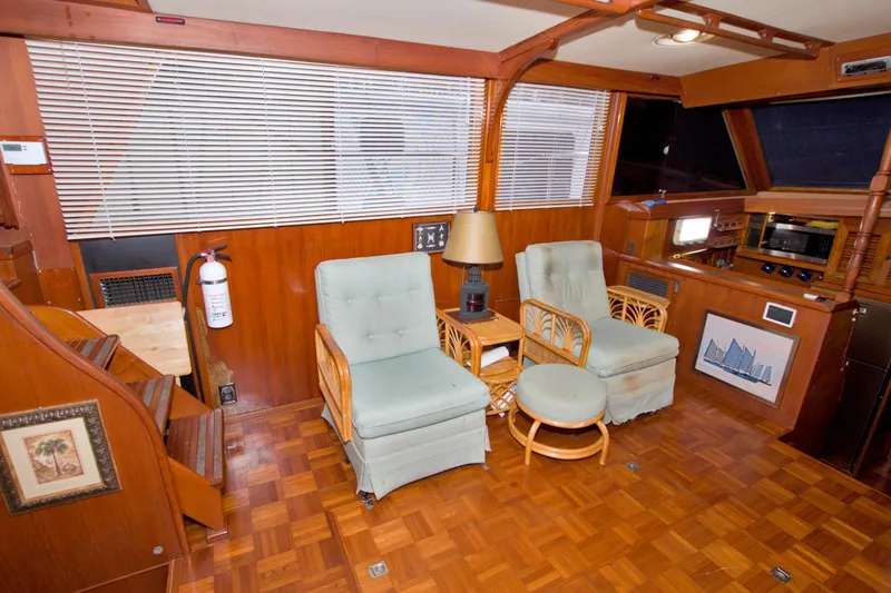 Slide: The Image of Interior of 1984 Present Yachts 42 Sundeck with wooden decor and comfortable seating. - 29