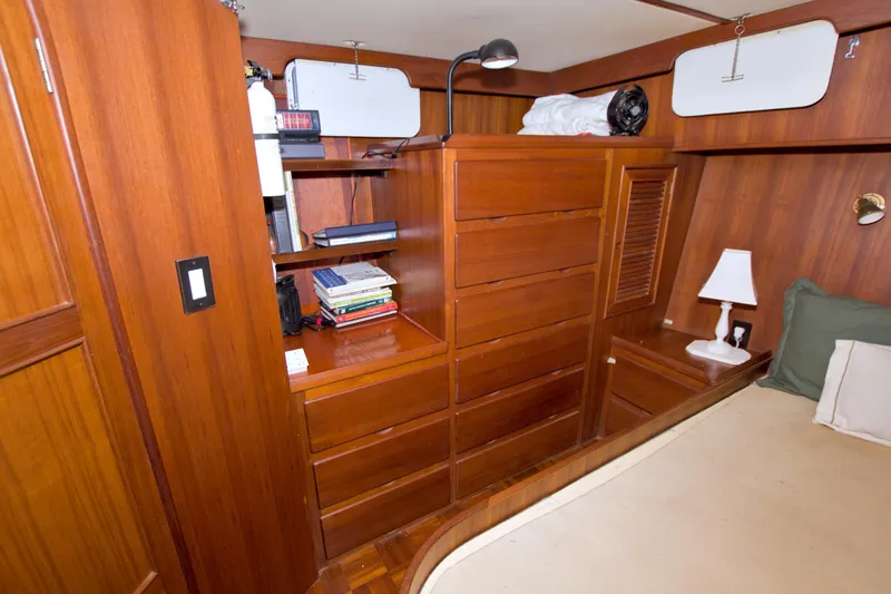 Slide: The Image of Interior of 1984 Present Yachts 42 Sundeck with wooden cabinetry and cozy furnishings. - 57
