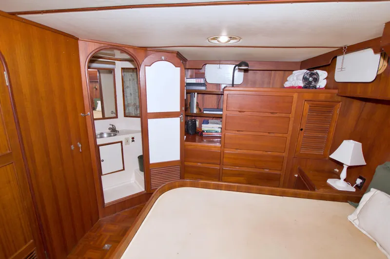 Slide: The Image of Interior of 1984 Present Yachts 42 Sundeck with wood cabinetry and cozy furnishings. - 58