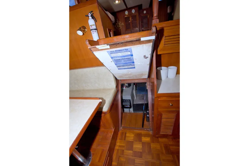 Slide: The Image of Interior of 1984 Present Yachts 42 Sundeck with open hatch and fire extinguisher. - 63