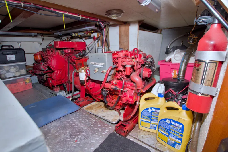 Slide: The Image of Engine room of a 1984 Present Yachts 42 Sundeck with Westerbeke generator and equipment. - 65