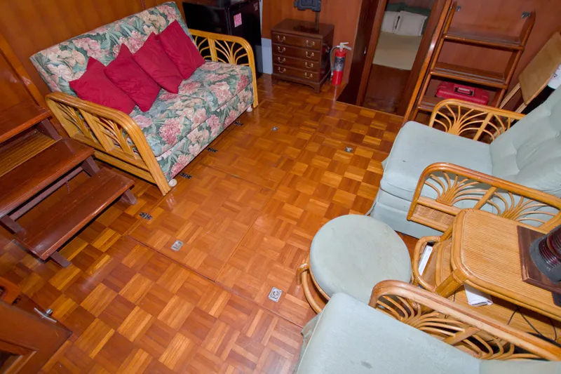 Slide: The Image of Interior of 1984 Present Yachts 42 Sundeck with floral sofa and wooden furniture. - 66