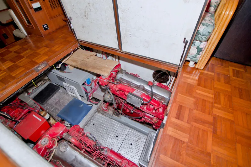 Slide: The Image of Engine room of 1984 Present Yachts 42 Sundeck with visible red machinery. - 68