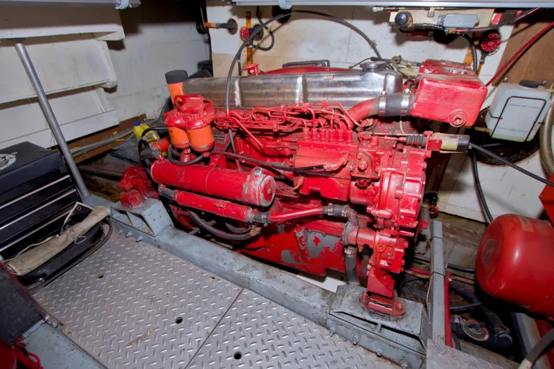 Slide: The Image of Engine room of 1984 Present Yachts 42 Sundeck with red machinery components. - 72
