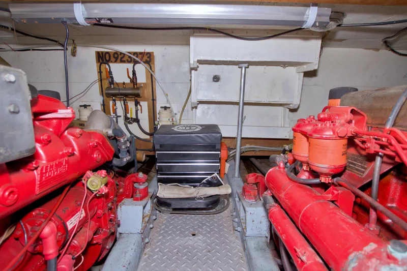 Slide: The Image of Engine room of a 1984 Present Yachts 42 Sundeck with visible machinery and components. - 76
